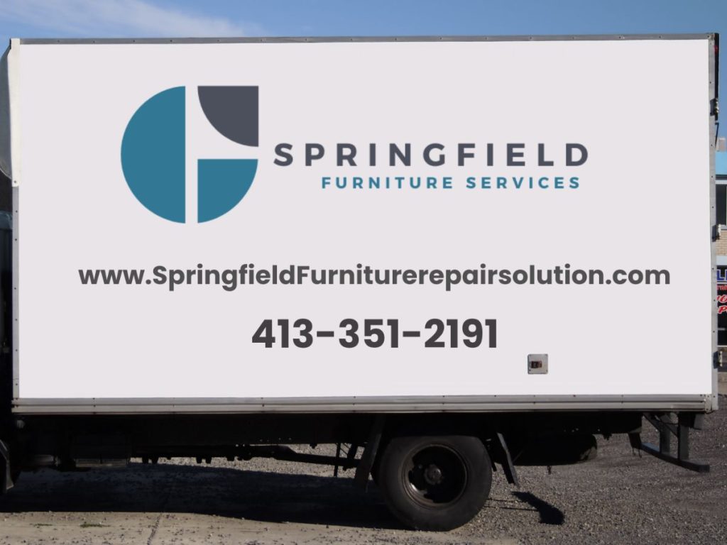 Delivery truck side displaying "Springfield Furniture Services" logo, along with website and contact information for repairs.